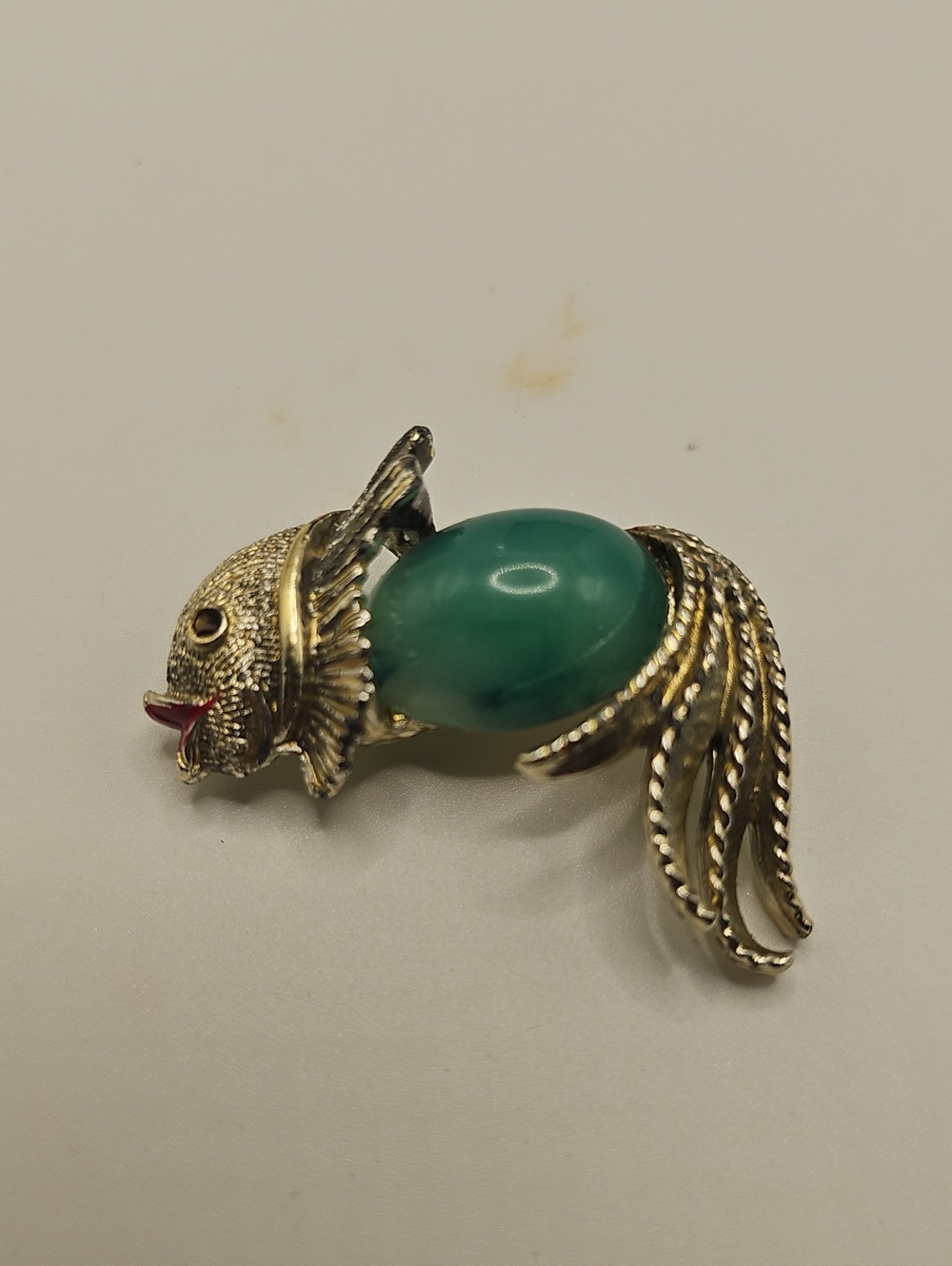 Gold-Tone Fish Brooch with Green Cabochon. Lucite Jelly Belly Bead.